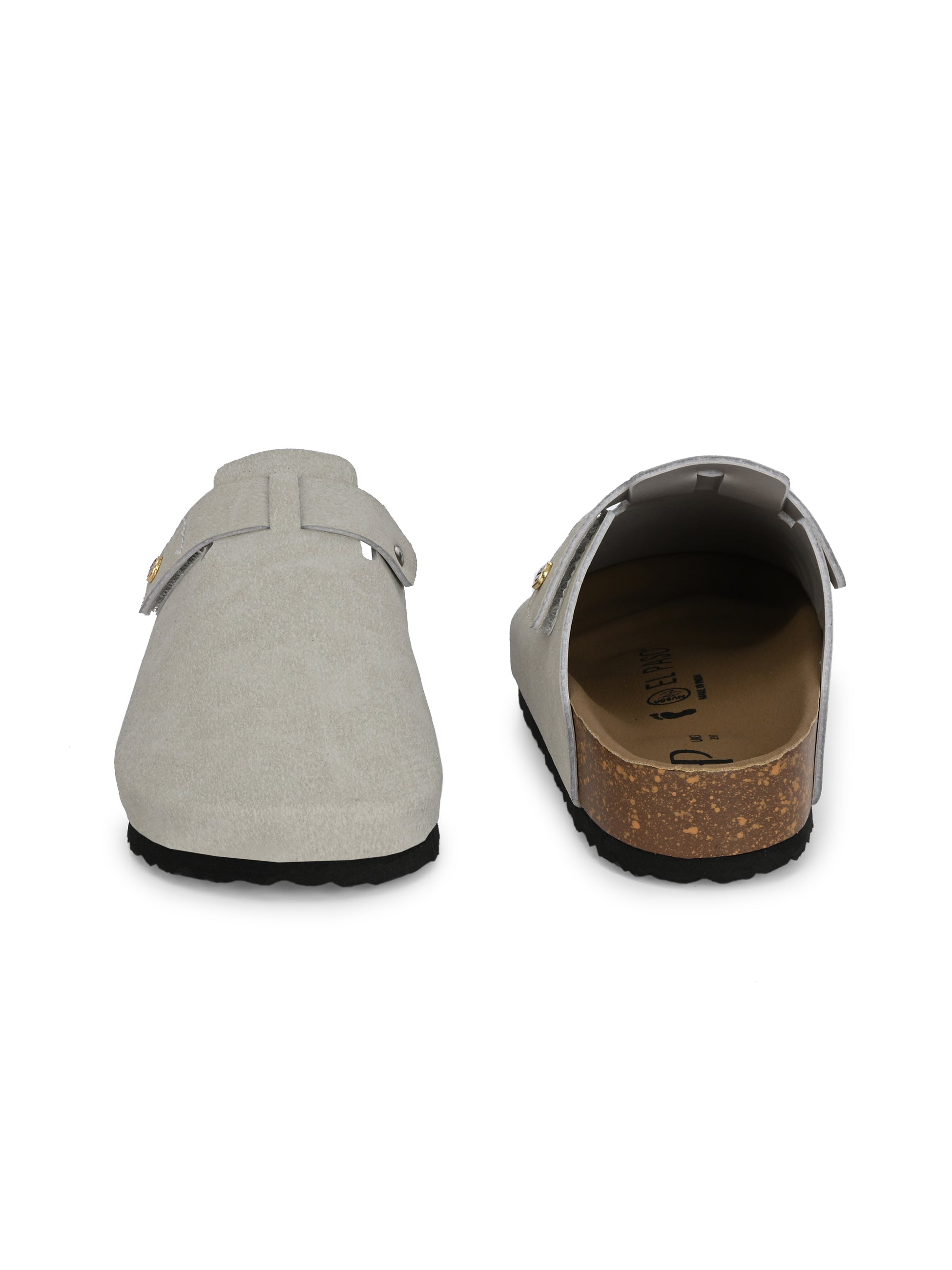 Nude suede slip-on clog with a black rubber sole and adjustable strap.