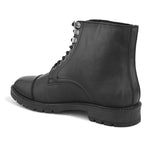 Black Faux Leather Casual boot with cap toe, silver eyelets, grooved rubber sole, and subtle brand logo near the ankle.