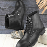 black lace up men boots with cap toe, silver eyelets, grooved rubber sole, and subtle brand logo near the ankle.