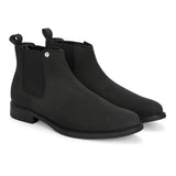 Black Chelsea boots with a matte finish, elastic side panels, pull-tab, and a subtle metallic logo accent.