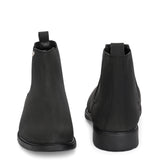 Black formal boots with a matte finish, elastic side panels, pull-tab, and a subtle metallic logo accent.