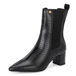 A stylish black ankle boot with a smooth leather finish, almond-shaped toe, mid-block heel, elastic side panel, and a gold accent logo.