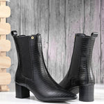 A sleek black crocodile-textured ankle boot with a pointed toe and mid-block heel, featuring an elastic side panel and a gold accent logo.