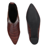 A stylish Tan ankle boot with a smooth leather finish, almond-shaped toe, mid-block heel, elastic side panel, and a gold accent logo.