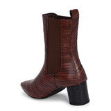 A stylish Tan ankle boot with a smooth leather finish, almond-shaped toe, mid-block heel, elastic side panel, and a gold accent logo.