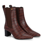 A sleek Tan crocodile-textured ankle boot with a pointed toe and mid-block heel, featuring an elastic side panel and a gold accent logo.