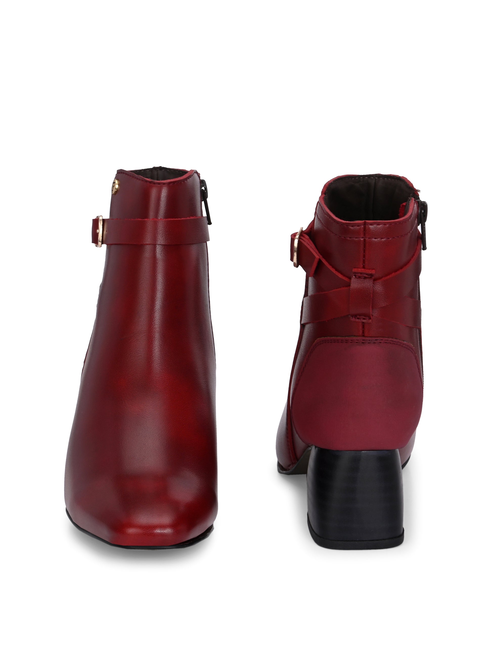 Cherry leather ankle boots with a block heel, buckle strap, and gold detailing, perfect for casual and formal wear.