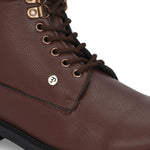 Brown lace-up ankle boots with a textured leather finish, padded collar, metal eyelets, and a rugged sole design.