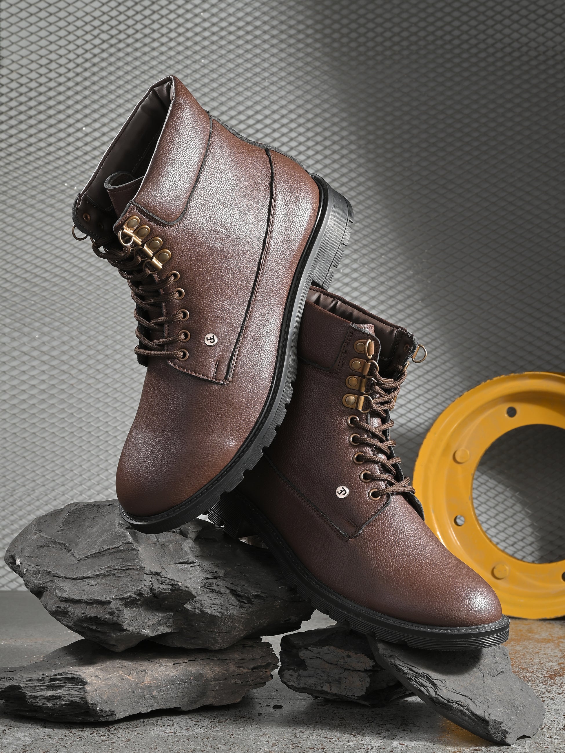 Men's brown high-top lace-up boots with textured leather, padded collar, metal eyelets, and a rugged sole.