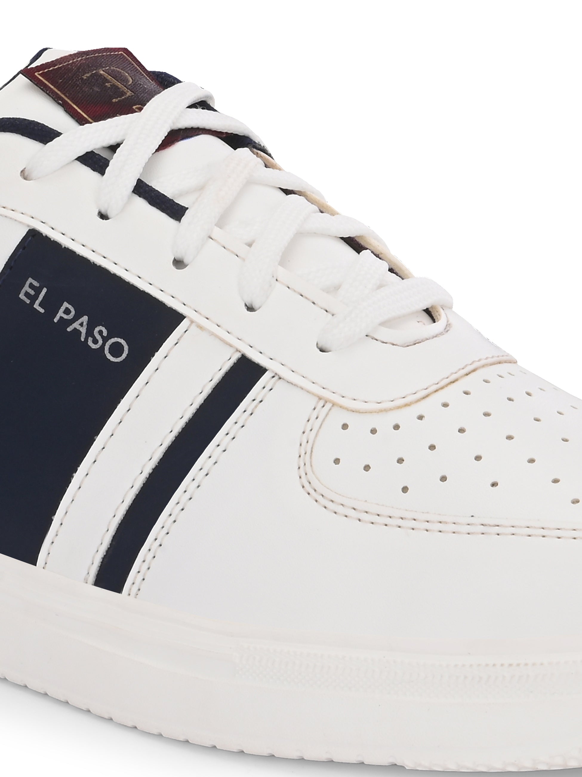 White lace-up sneakers featuring a navy blue stripe detail on the sides, perforated detailing on the toe, and a lightweight rubber sole.