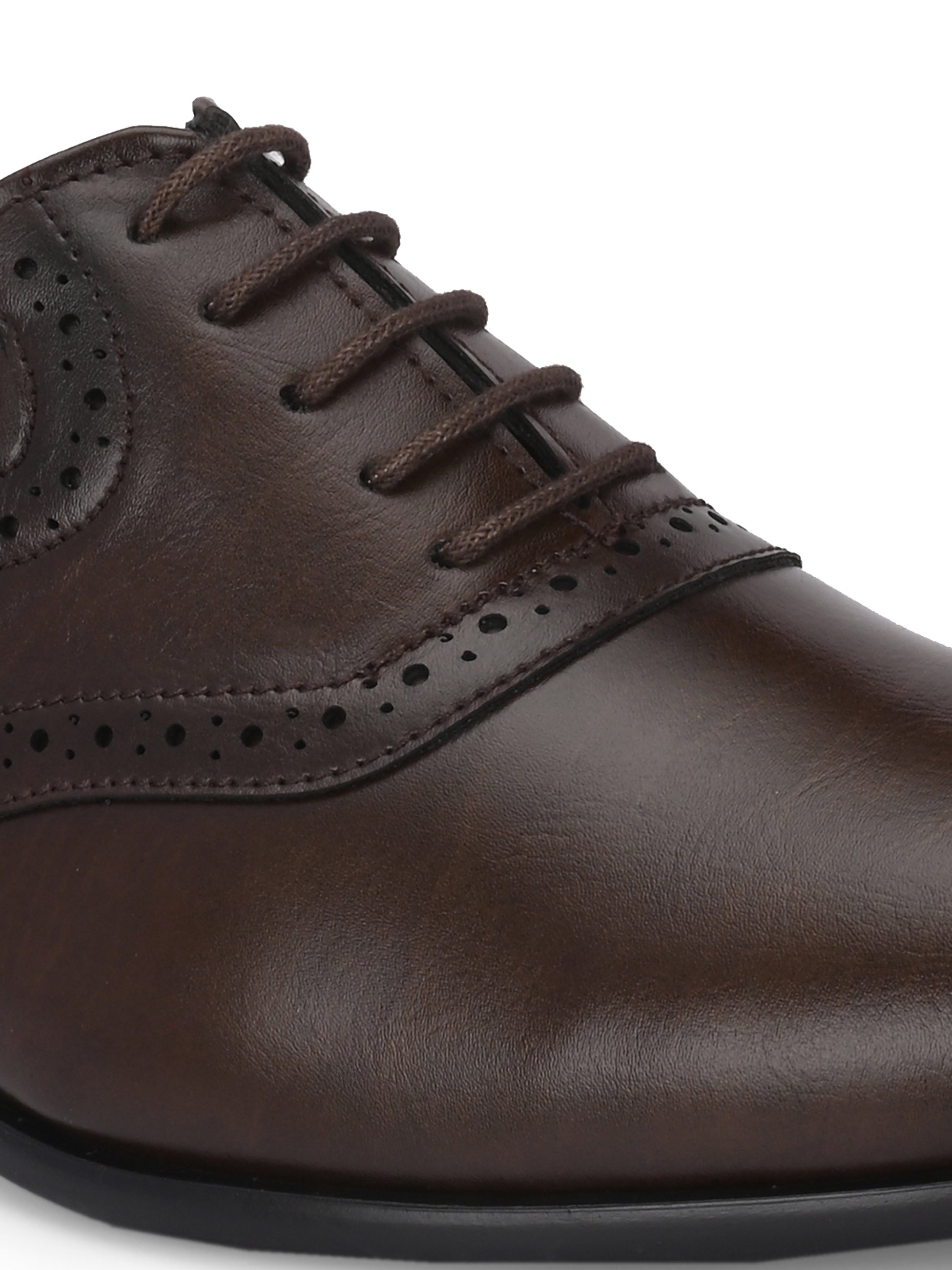 Men's brown faux leather oxford shoe with perforated brogue detailing, lace-up closure, and a low stacked heel.