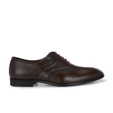 Men's brown faux leather oxford shoe with perforated brogue detailing, lace-up closure, and a low stacked heel.