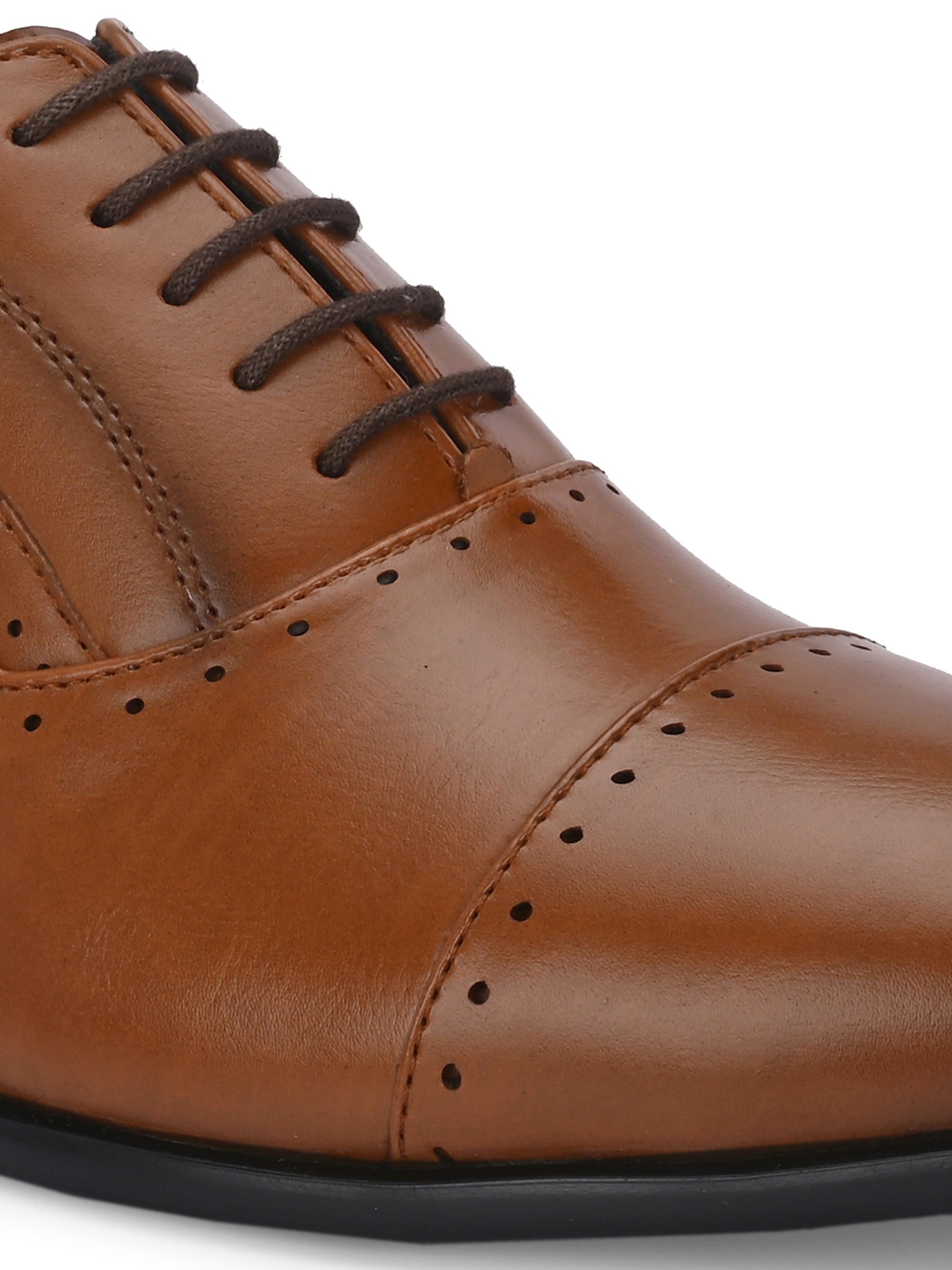 A brown leather dress shoe with a lace-up design, featuring decorative perforations along the toe cap and sides, and a low black heel.