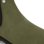 Olive formal boots with a matte finish, elastic side panels, pull-tab, and a subtle metallic logo accent.