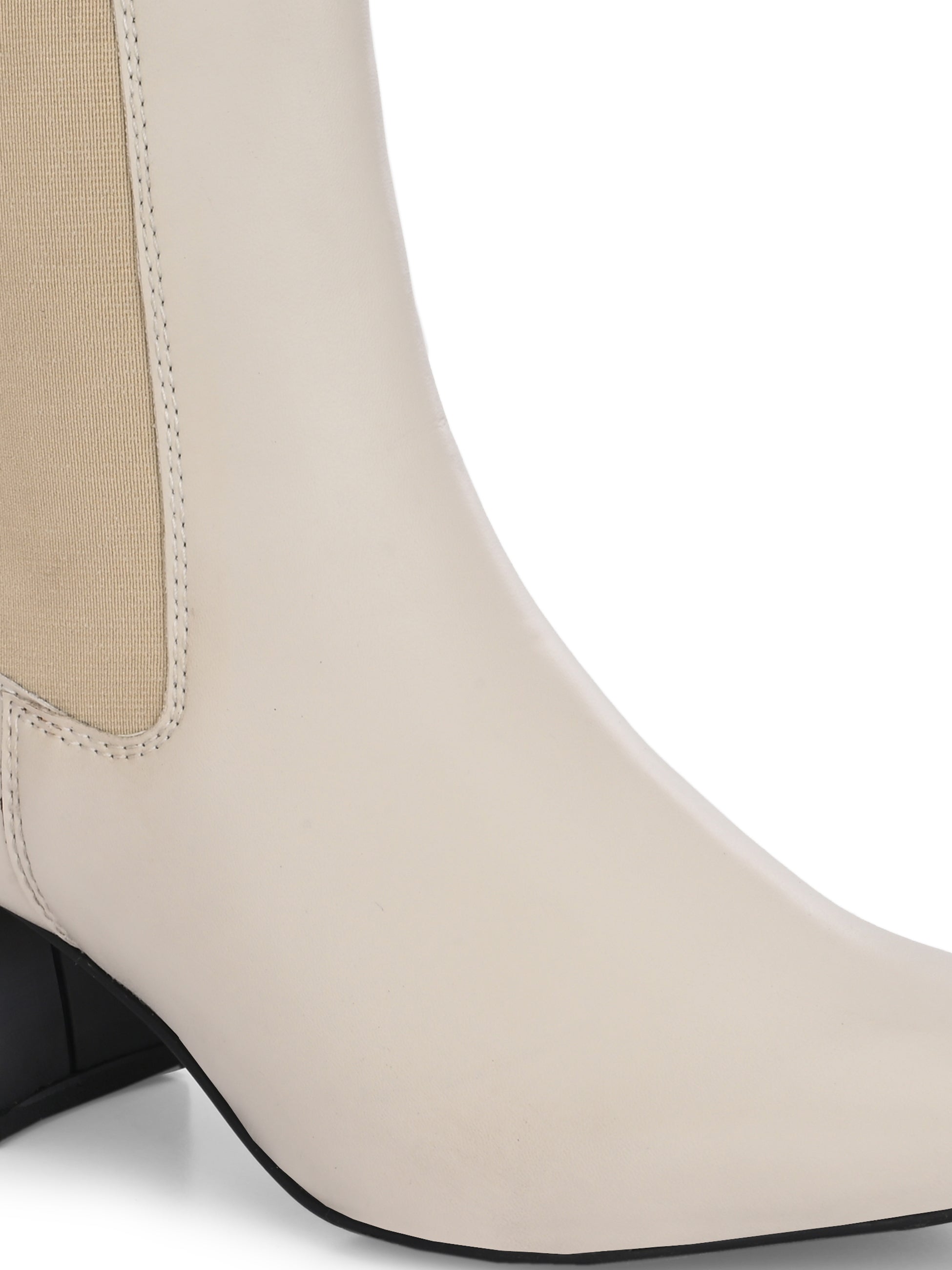 beige ankle boot with a smooth leather finish, elastic side panels, pull-tab, block heel, and pointed toe.