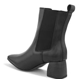 Black ankle boot with a smooth leather finish, elastic side panels, pull-tab, block heel, and pointed toe.