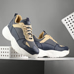 Navy blue and beige sneakers with a sleek design and durable chunky sole, perfect for a modern and stylish look. These are sleek design sneakers for men, combining comfort and fashion.