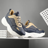 Navy blue and beige sneakers with a sleek design and durable chunky sole, perfect for a modern and stylish look. These are sleek design sneakers for men, combining comfort and fashion.