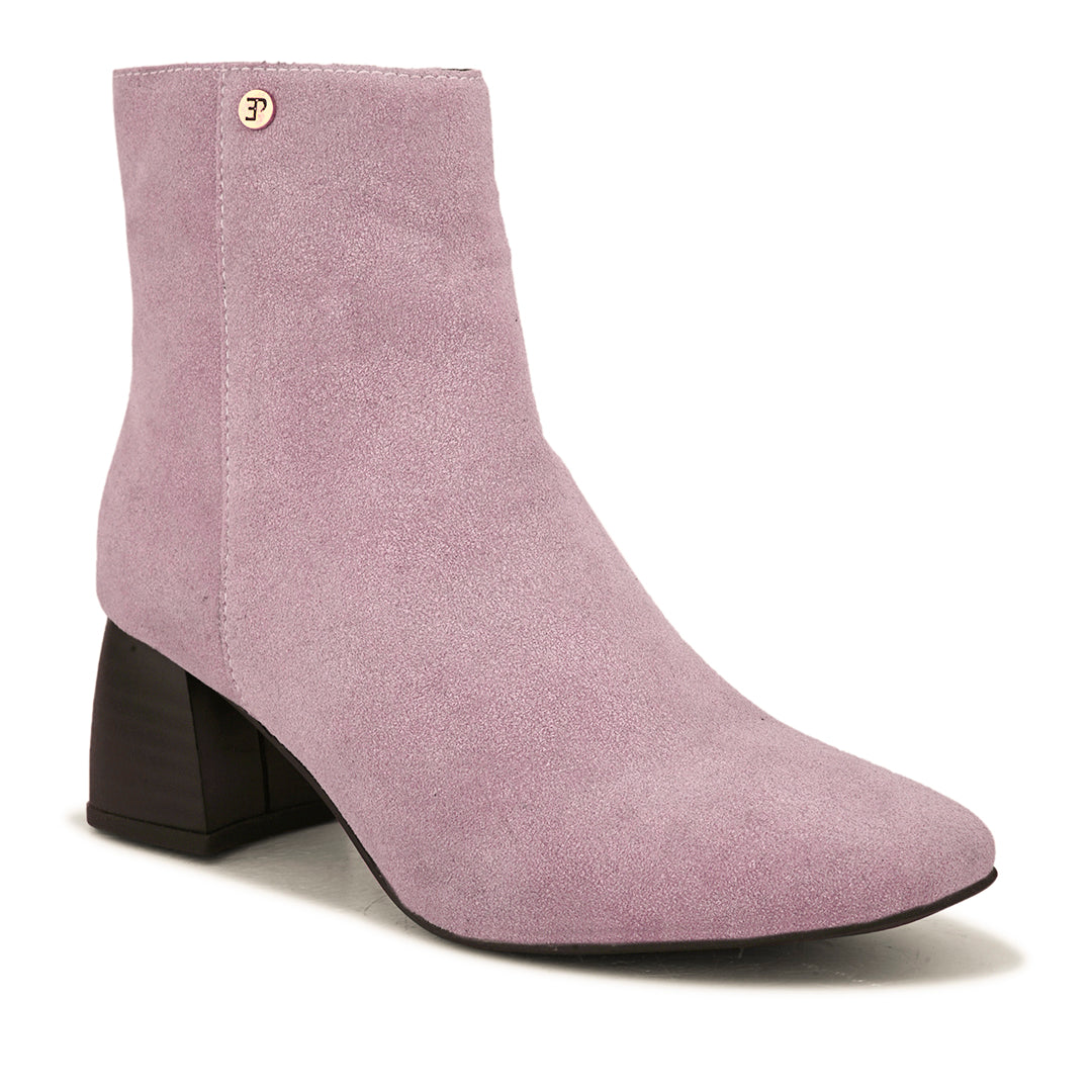 Light pink suede ankle boots with a sleek design and block heel.
