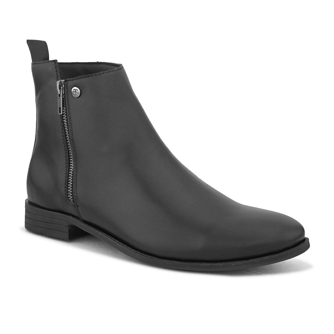 A sleek black leather Chelsea boot with a side zipper, pull-tab at the back, and a low block heel.