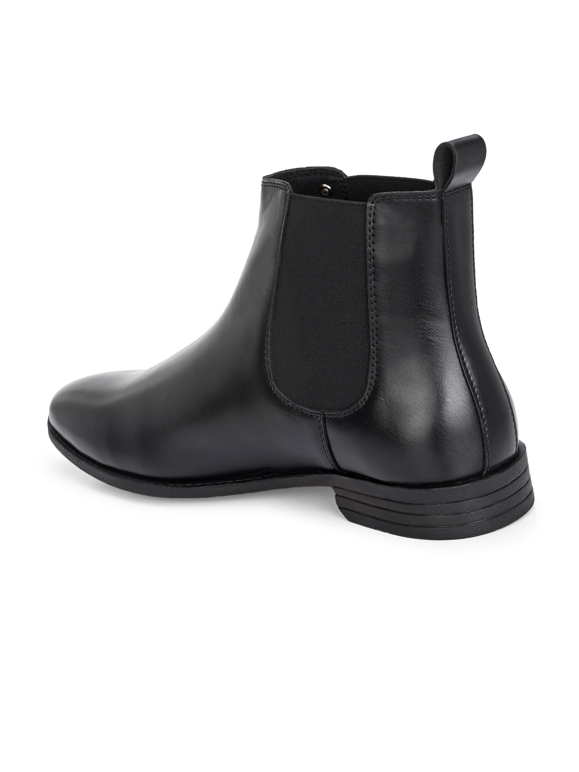 A sleek black leather Chelsea boot for women with elastic side panels, pull tab, low stacked heel, and a polished finish for a versatile look.