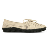 A beige women's flat with a perforated woven upper, round toe, metallic-tipped bow, and flexible black rubber outsole for comfort and casual wear.