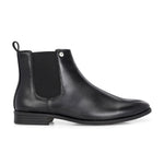 A sleek black leather Chelsea boot for women with elastic side panels, pull tab, low stacked heel, and a polished finish for a versatile look.