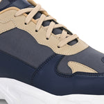 Navy blue and beige sneakers with a sleek design and durable chunky sole.