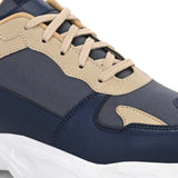 Navy blue and beige sneakers with a sleek design and durable chunky sole.