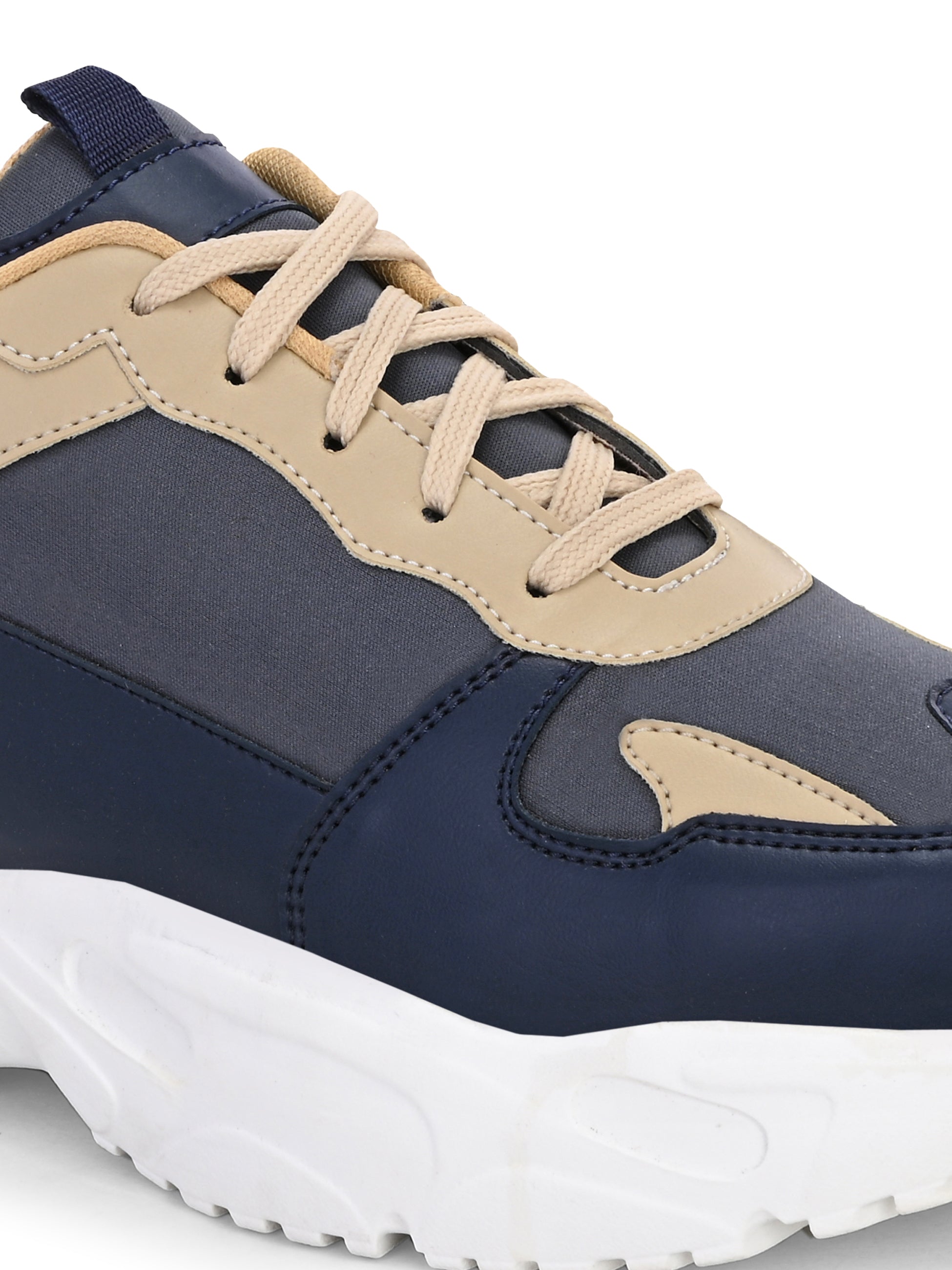 Navy blue and beige sneakers with a sleek design and durable chunky sole.