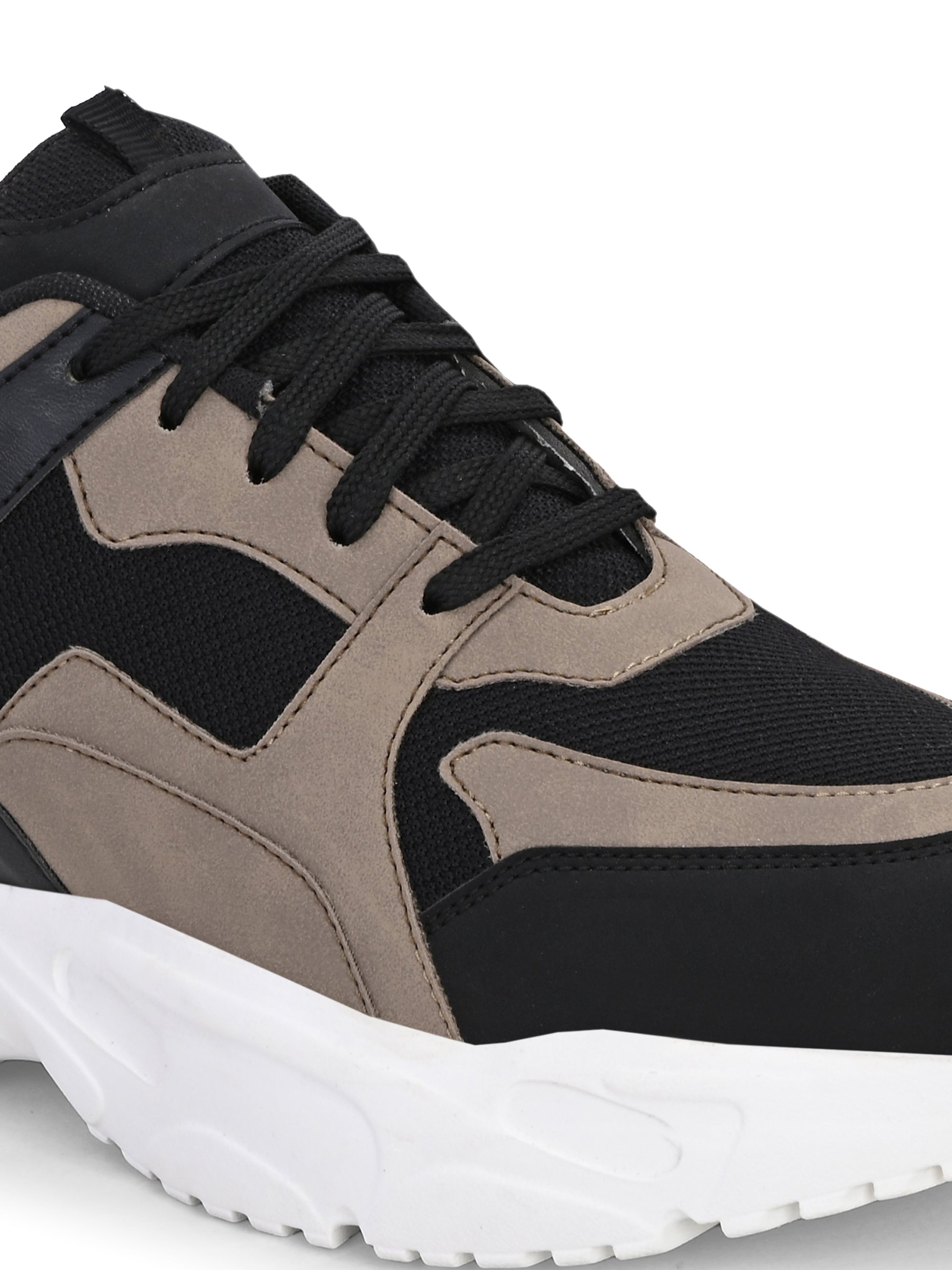 Stylish black and beige sneakers with a modern chunky white sole.