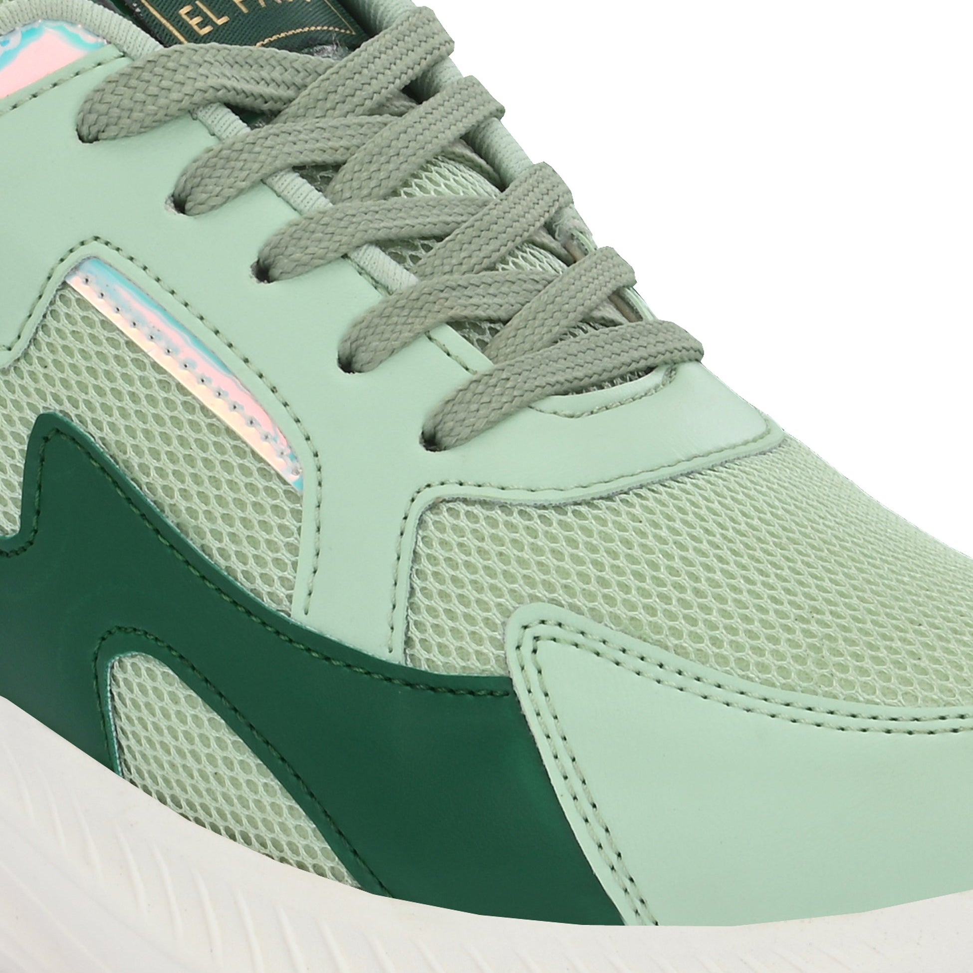 A green and white tennis shoe, designed for athletic activities.