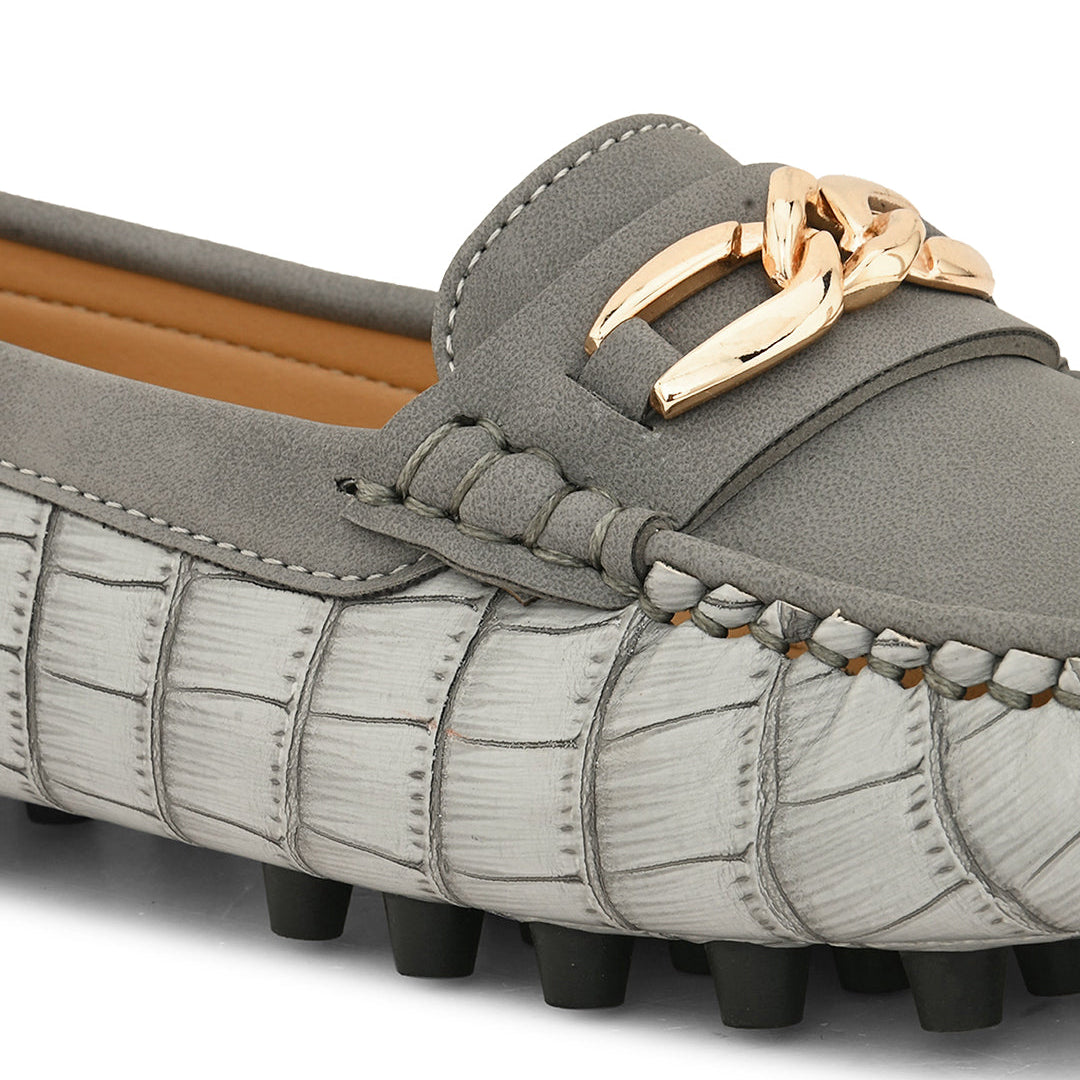 A gray slip-on shoe with a sleek design.