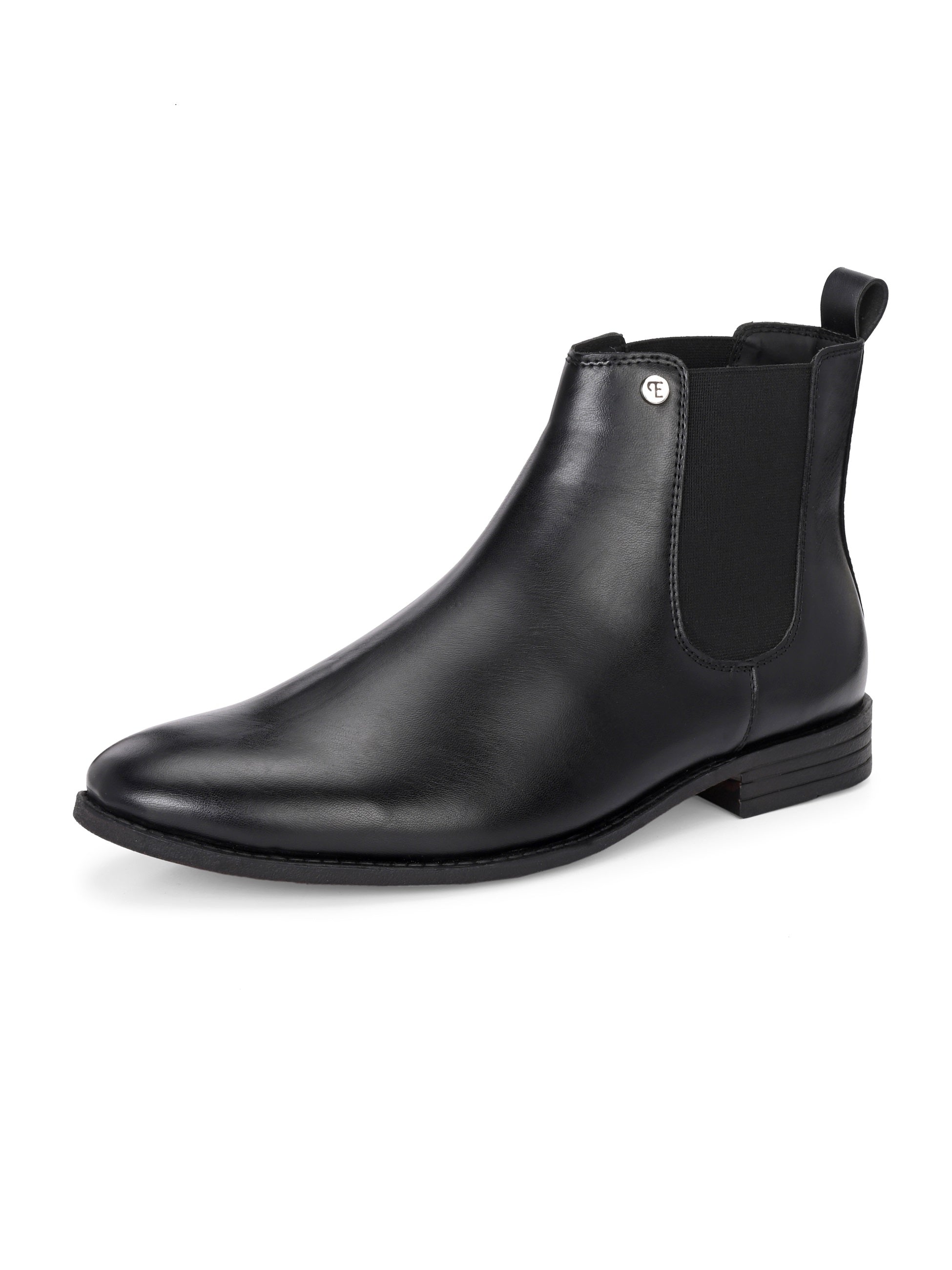 A sleek black leather boot with elastic side panels, pull tab, low stacked heel, and a polished finish for a versatile look.