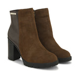 Brown suede ankle boots with a block heel, plus mid-top leather slip-on boots for versatile style and comfort.