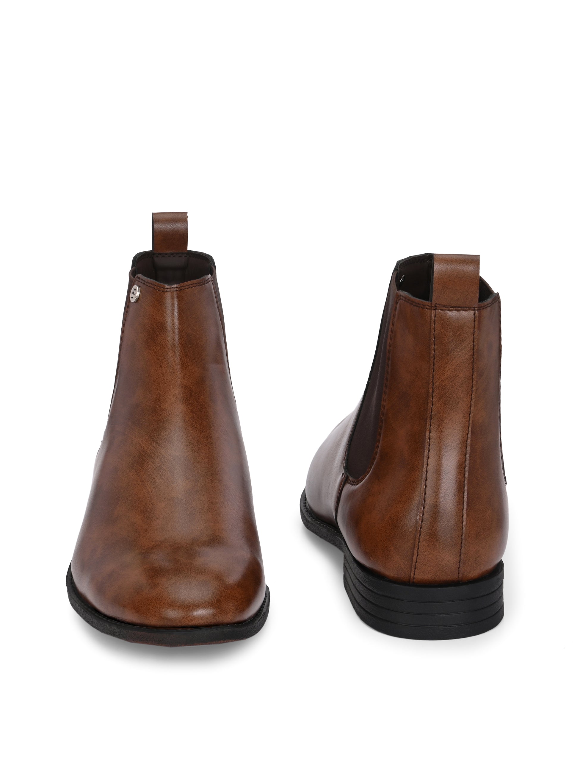 A sleek brown leather boot with elastic side panels, pull tab, low stacked heel, and a polished finish for a versatile look.