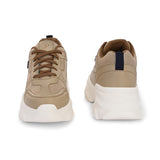 Beige sneaker with a textured white sole, brown laces, and modern detailing, designed for casual and stylish wear.