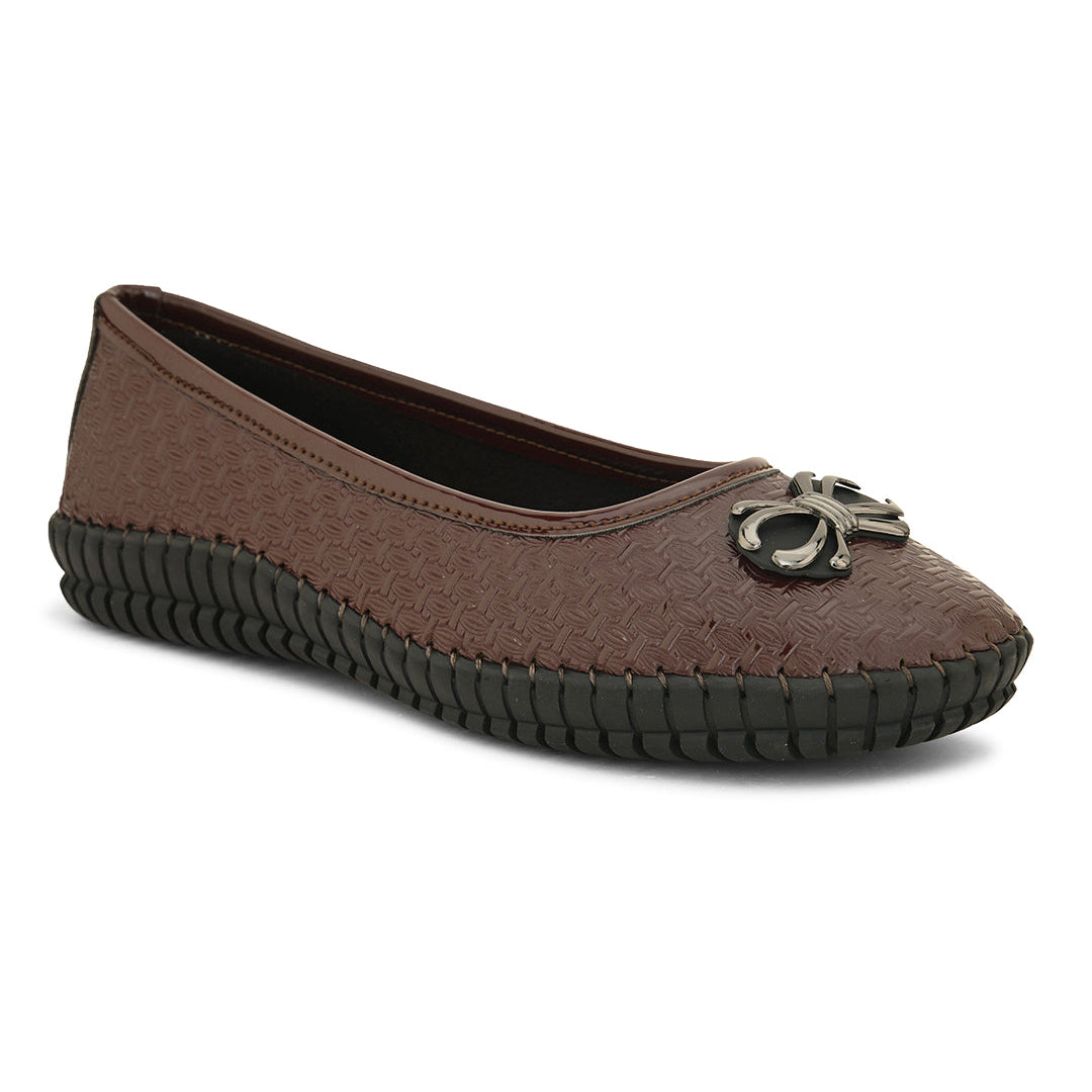 A brown woven-texture flat shoe with a round metal ornament on the toe and a black rubber sole.