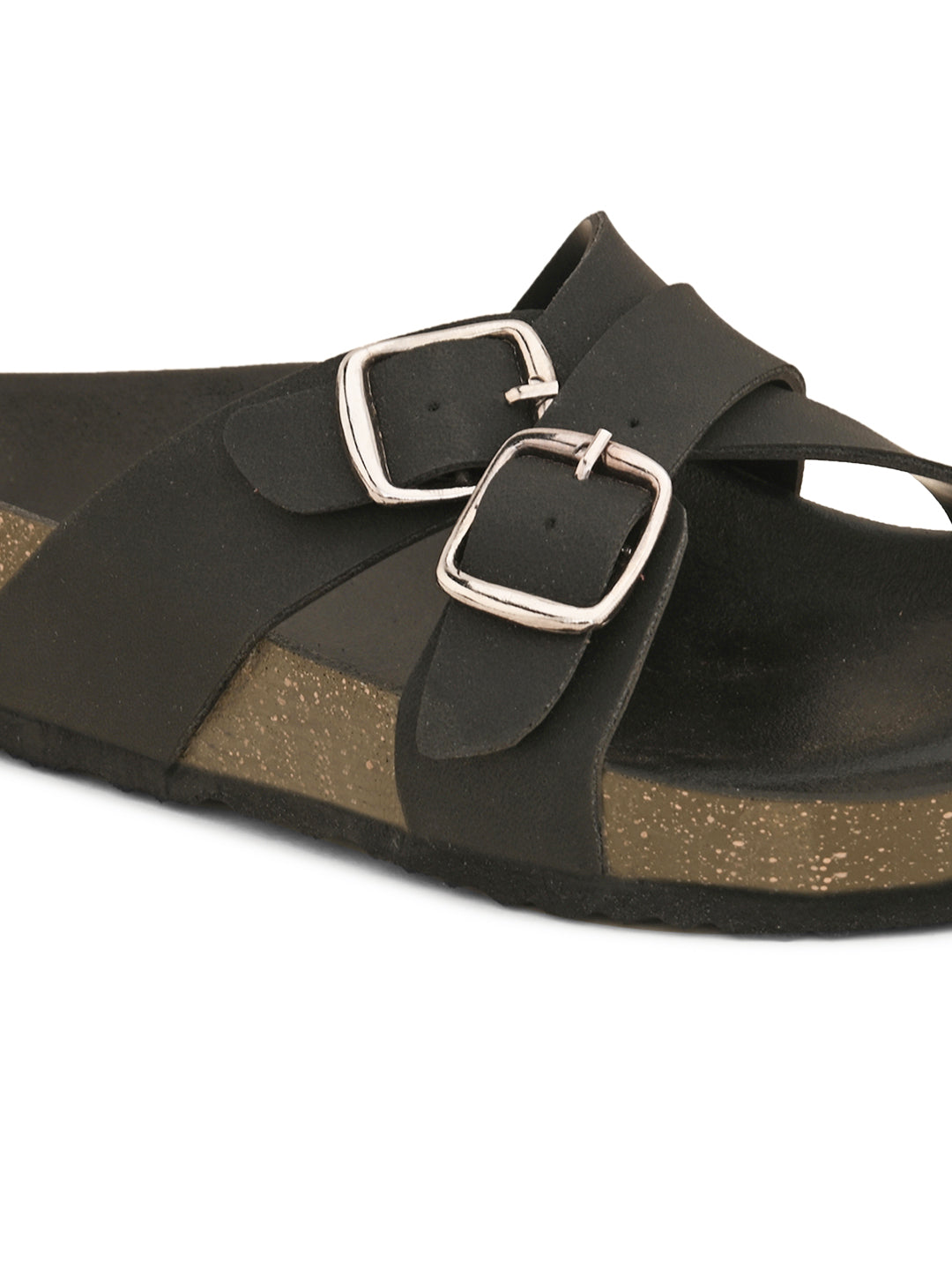 Black slip-on flats, showcasing its design and material details.