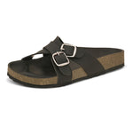 Black slip-on flats, showcasing its design and material details.