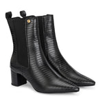 A sleek black crocodile-textured ankle boot with a pointed toe and mid-block heel, featuring an elastic side panel and a gold accent logo.