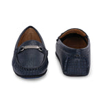 A stylish navy-blue loafer with a textured crocodile-pattern design, featuring a metallic buckle detail on the upper and colorful accents on the outsole.
