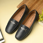 A stylish navy-blue casual slip-on loafer for women with a textured crocodile-pattern design, featuring a metallic buckle detail on the upper and colorful accents on the outsole.