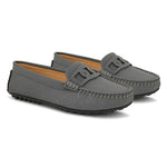 A gray loafer for women with textured stitching and a decorative strap across the top, viewed from the side.