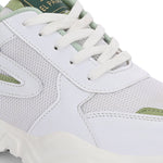 A green tennis shoe with a sleek design and lightweight construction, suitable for athletic activities.