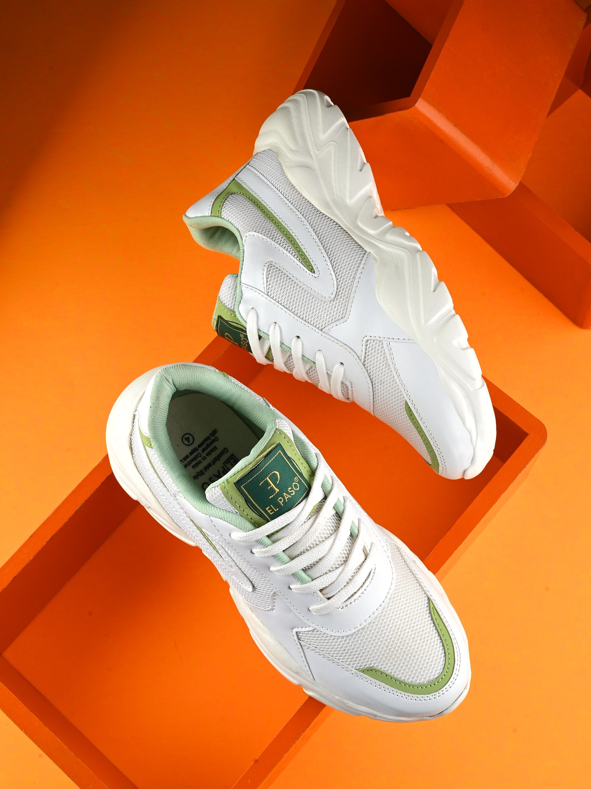 Women Sneakers in green with a sleek design and lightweight construction, perfect for athletic activities and all-day comfort.