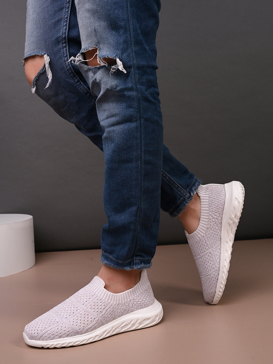 Light pink Slip-On Lightweight Women Shoes with a breathable knitted upper, perforated design for ventilation, and a cushioned white sole for comfort and flexibility.