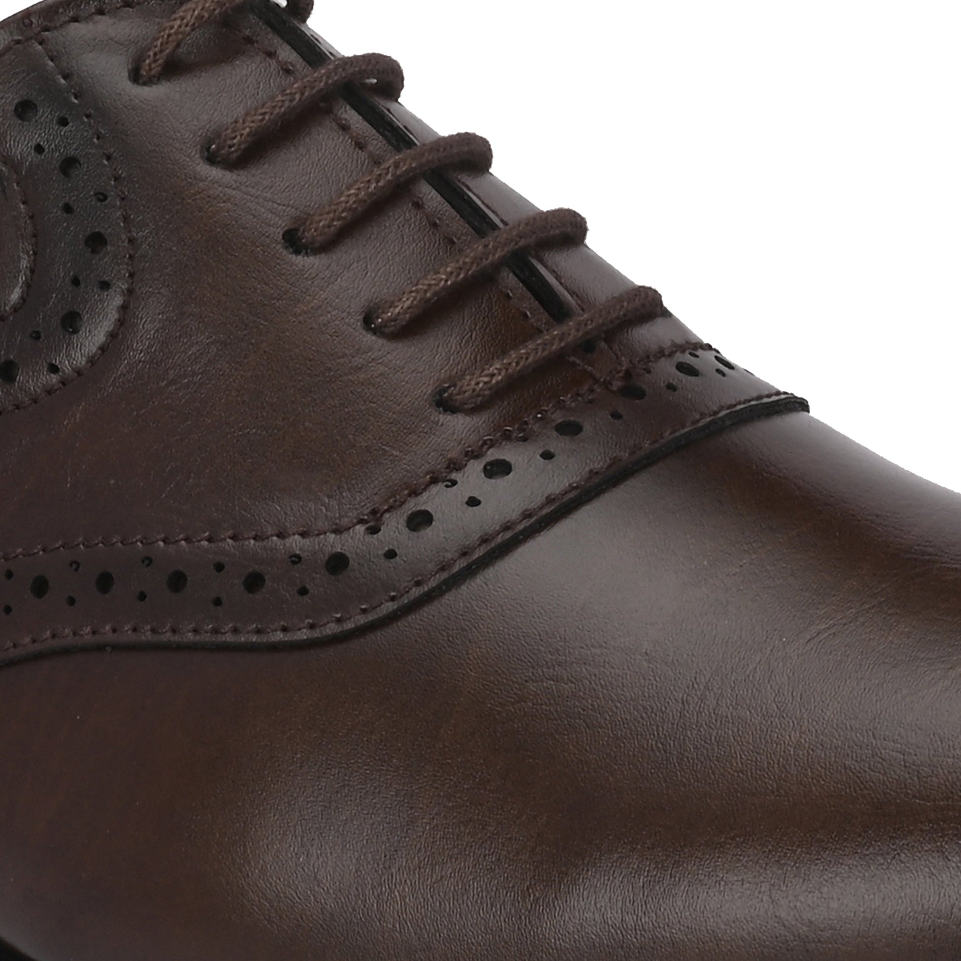 Men's brown faux leather oxford shoe with perforated brogue detailing, lace-up closure, and a low stacked heel.