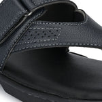 A navy blue leather sandal with a thong style and a padded footbed, featuring a curved strap design on a black sole.