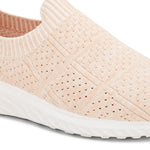 Peach slip-on sneaker with a breathable knitted upper, perforated design for ventilation, and a cushioned white sole for comfort and flexibility.